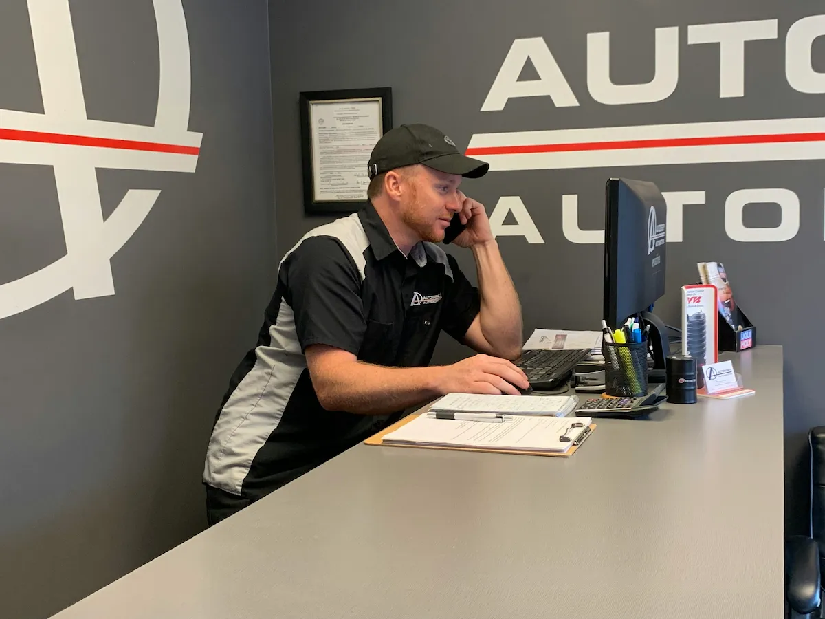 Mechanic discussing vehicle repairs with a customer