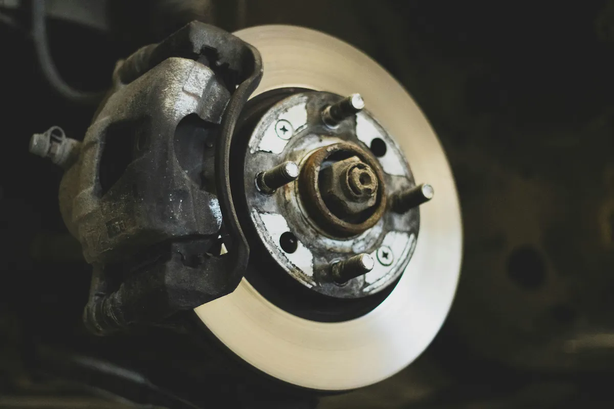 Technician servicing a vehicle brake system